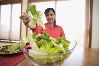 Hispanic woman eating salad