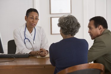Doctor talking with a couple