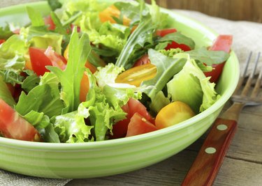 fresh healthy salad with tomatoes and arugula