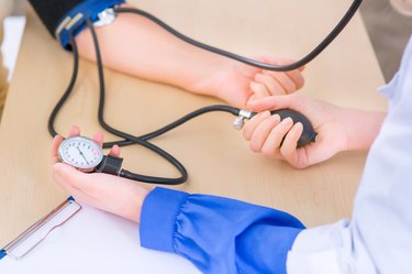 Pleasant nurse speaking with her patient