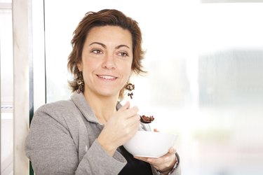 Businesswoman eating her breakfast