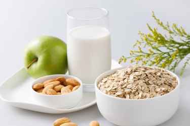 "Oatmeal with almonds,apple and glass of milk"