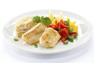 Fried cod fillets and vegetables