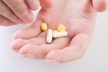 Vitamin tablets in a hand