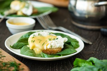 Poached egg on a piece of bread with spinach