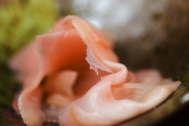 Close-up view of pickled ginger slices.