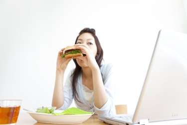 Young woman eating a sandwich