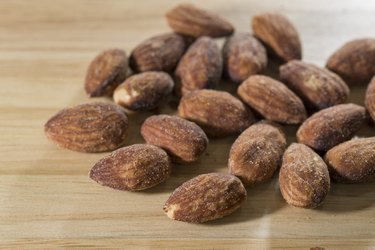 Almond on wood background