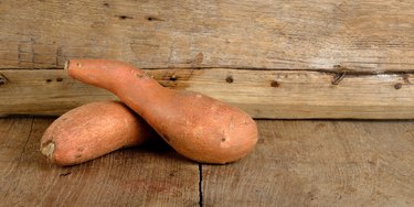 Sweet potato on the wooden background