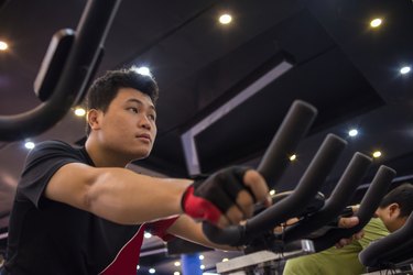 Man focus on doing exercise in the gym