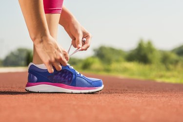 Tying sports shoe