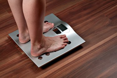 Woman's feet on weight scale