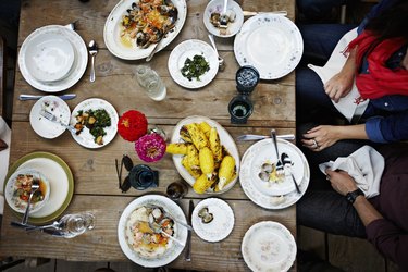 Overhead view of friends dining mid-meal