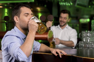 Drinking a freshly tapped beer.