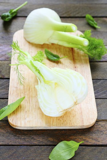 two halves of fennel on the board