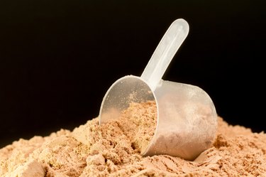 Whey protein drink powder on a black background