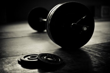 Barbell and discs in a weightlifting gym