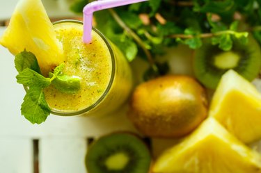 Smoothies of kiwi and pineapple on the table. Top view