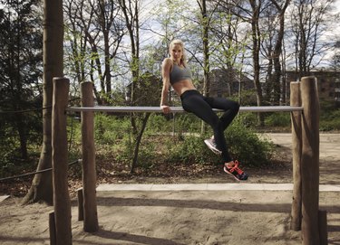 Fitness female taking rest after workout at park