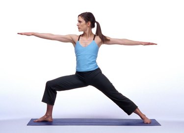 Caucasian Woman Posing On A Blue Yoga Mat