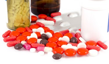 Medicine pills and bottles on a white background