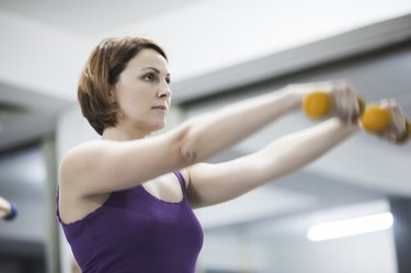 Beautiful woman exercising pilates