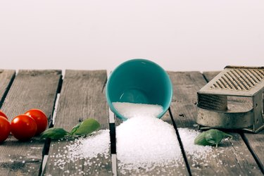 Spilled salt on a wooden table