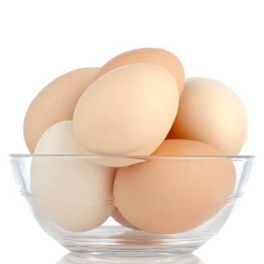 Brown eggs in transparent bowl