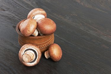 small bowl of champignon mushrooms on a table