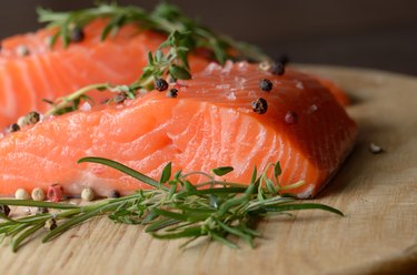 Raw salmon on cutting board