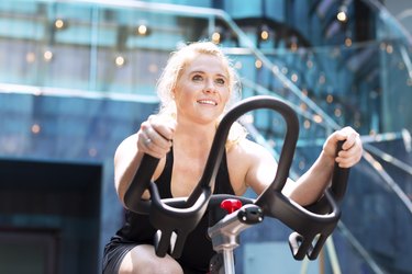 Girl driving stationary bik