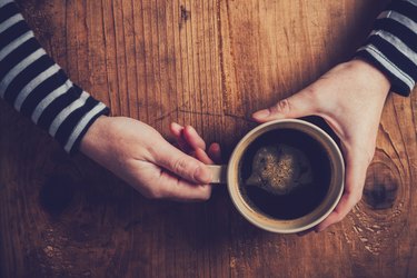 Lonely woman drinking coffee in the morning