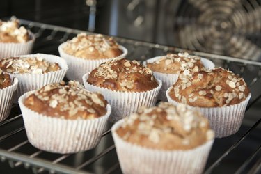 Freshly baked apple muffins with oat flakes
