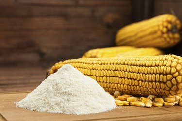 Domestic corn flour arranged with maize cob