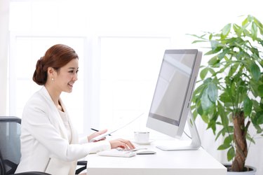 Young business lady using computer