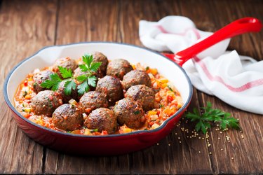 Meatballs with vegetable sauce in cast iron skillet