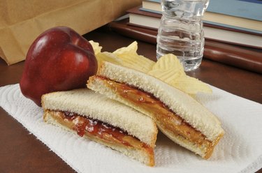 Peanut butter and jelly sandwich in a sack lunch