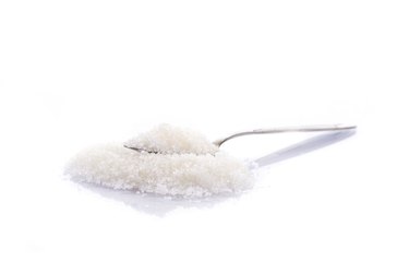 granulated sugar in a spoon