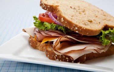 sandwich turkey bread calories whole wheat many grain club food getty livestrong bacon delicatessen cheese snacks sleep better simple life