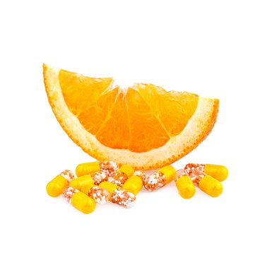 Vitamin pills and Orange Fruit