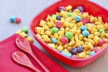 Bowl of cereal and spoons on wooden  table