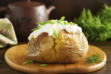 Baked potato with cream of the cream cheese closeup.