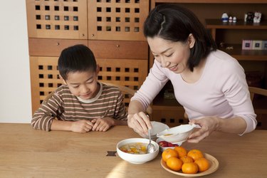 Mother Serving Dessert for Son