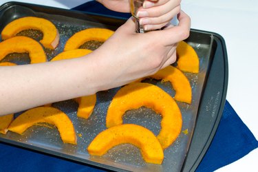 banana squash slices on baking sheet