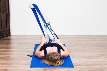 Woman Doing Single-Leg IT Band Stretch to Recover from an Injury