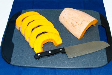 cut banana squash on cutting board