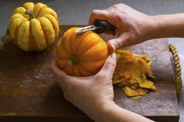 hand peeling pumpkin