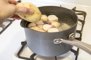 Add potato to pot of turnips