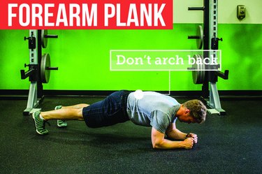 Man doing forearm plank with proper form to prevent back pain