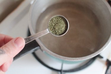 stevia powder over pot with boiling water